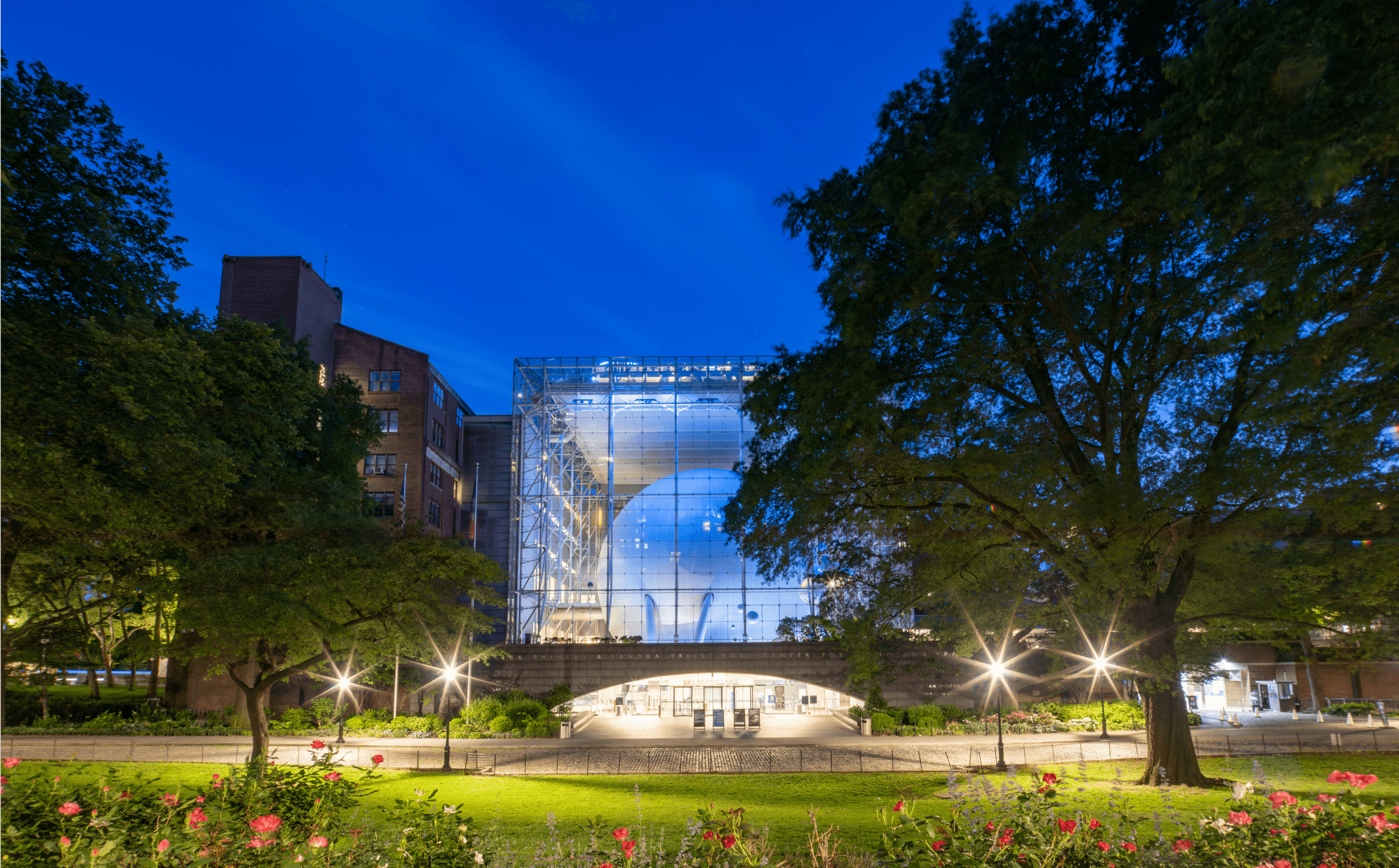 Natural History Museum in NYC featuring sleek glass facade, located in the UWS near The Henry Residences by Naftali Group.