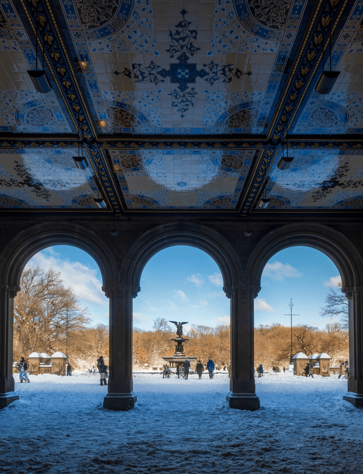 A picturesque view of snow-laden arches in Central Park, located near The Henry condominiums in Upper West Side.