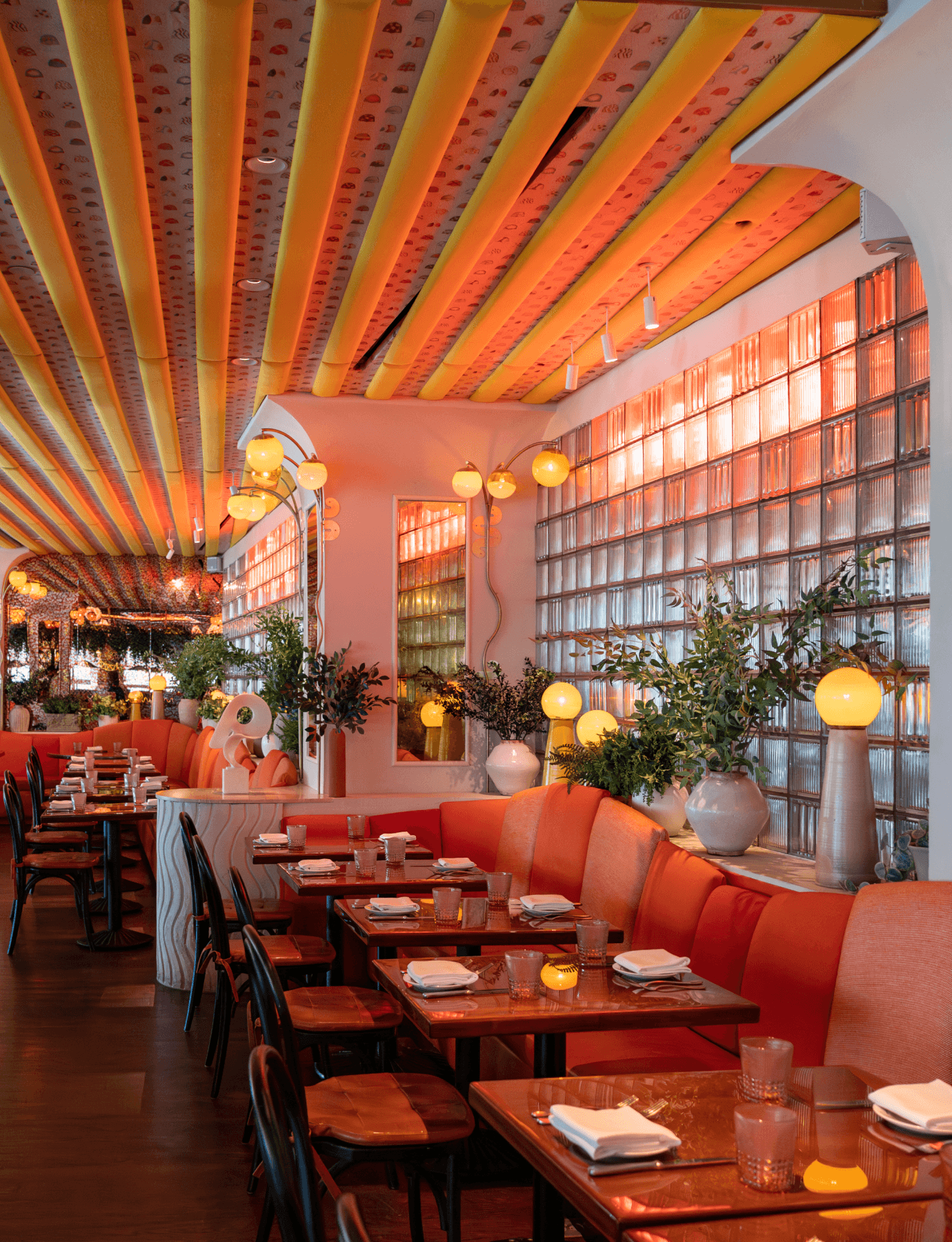 Vibrant UWS restaurant with red booths and tables, located near The Henry Residences at 211 W 84th Street.