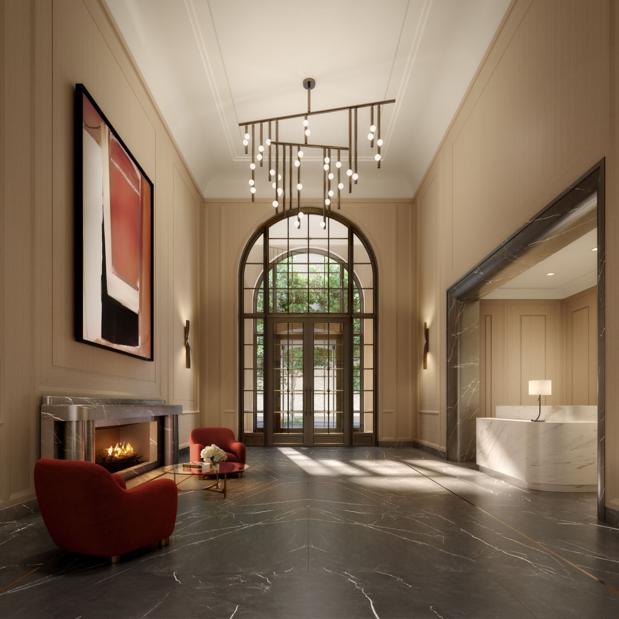 Elegant lobby at The Henry Residences in UWS, complete with fireplace, art, and arched windowed entryway.