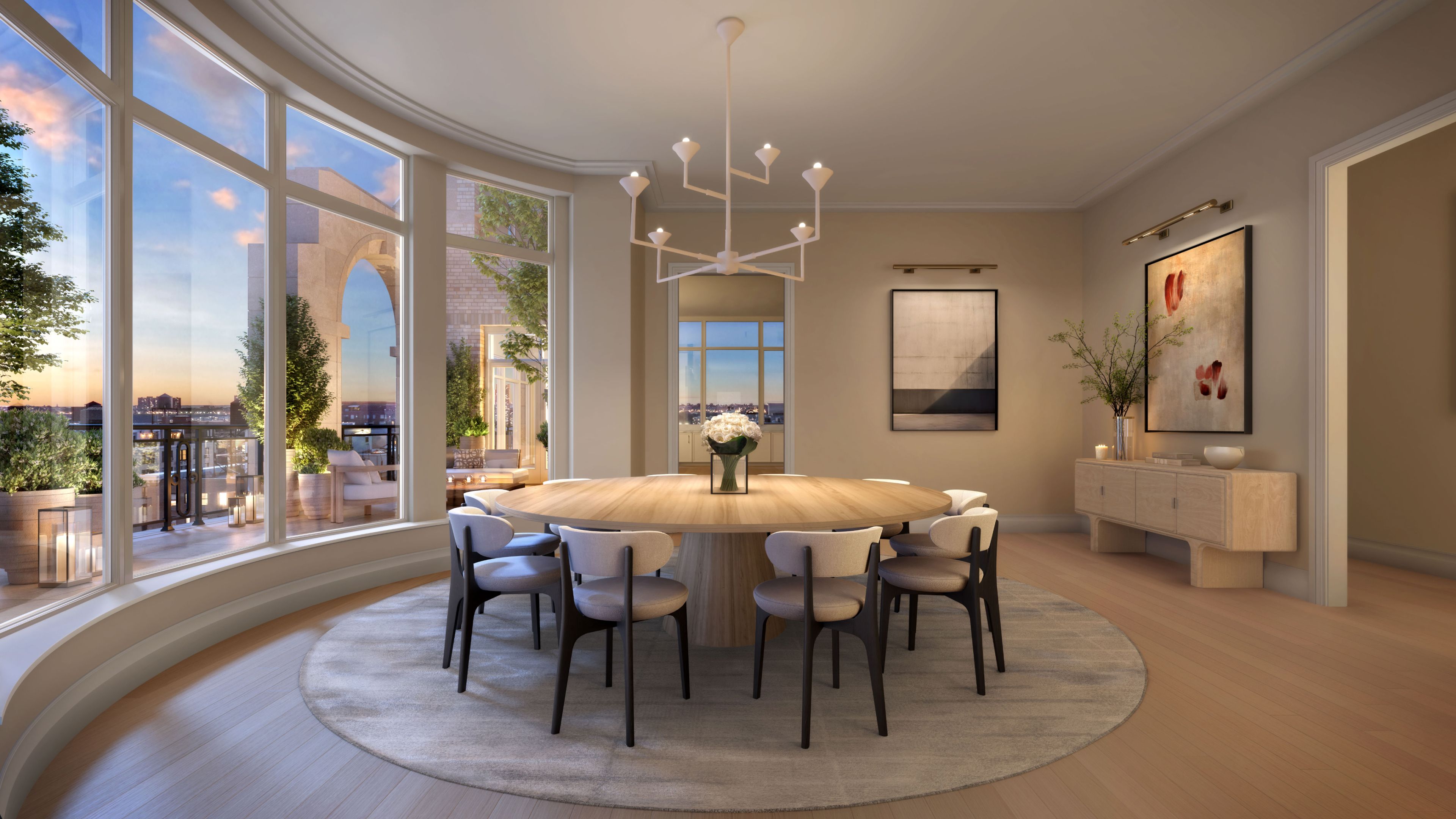 Elegant dining area with circular table, in a penthouse at The Henry Residences, Upper West Side new developments.