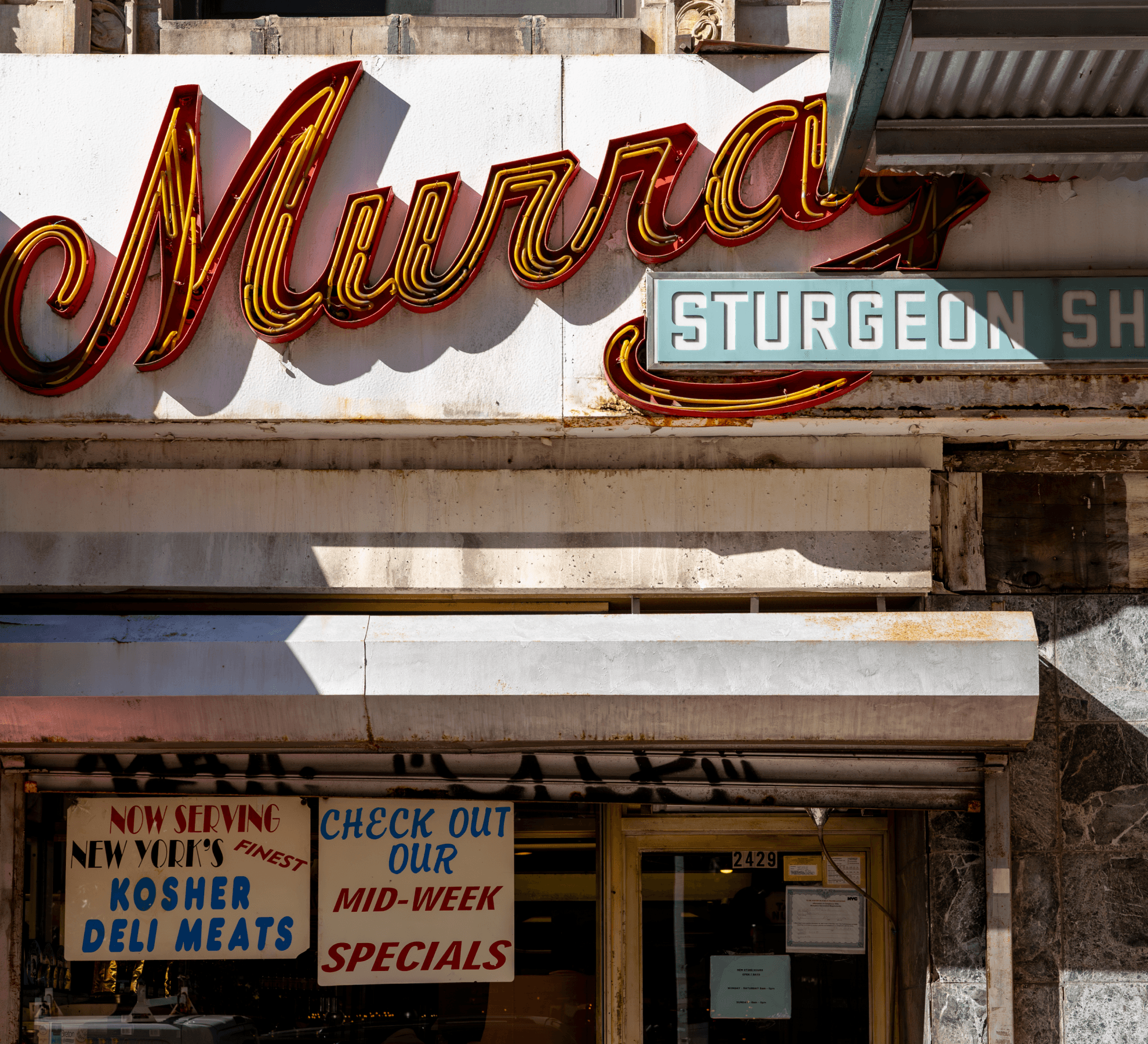 Front signage at Murray's Sturgeon Shop in Upper West Side NYC near The Henry Residences by Naftali Group.