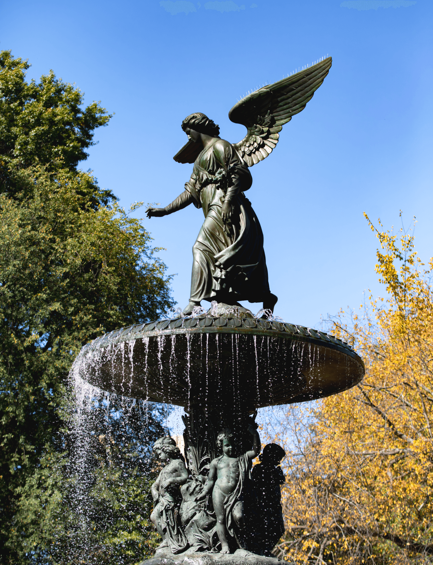 A serene angel statue atop a fountain in Central Park, near The Henry UWS condominiums by Naftali Group.